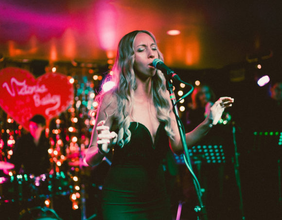 Woman singing on stage