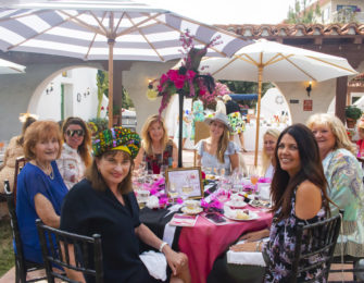 Image of people at a table during a tea party