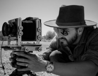 Nick Carver photographing in the desert